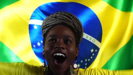 Brasilianische-junge-schwarze-Frau-feiert-mit-Brasilien-Flagge