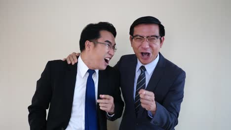 Two-businessman-laughing.