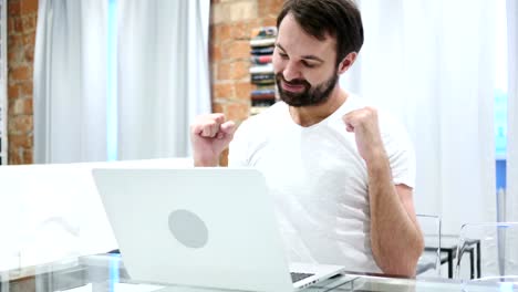 Young-Beard-Man-Listening-Music-and-Dancing-at-Home