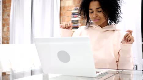 Young-Afro-American-Woman-Listening-Music-and-Dancing-at-Home