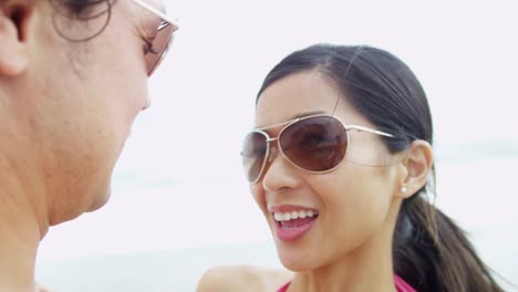 Attractive-young-ethnic-couple-enjoying-time-alone-beach