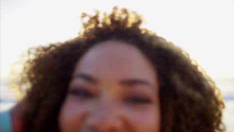 Portrait-of-Ethnic-female-laughing-on-video-diary