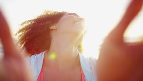 Portrait-of-Ethnic-female-beach-fun-at-sunrise