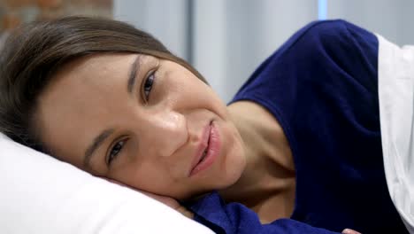 Smiling-Hispanic-Woman-Face-Lying-in-Bed,-Close-Camera-view