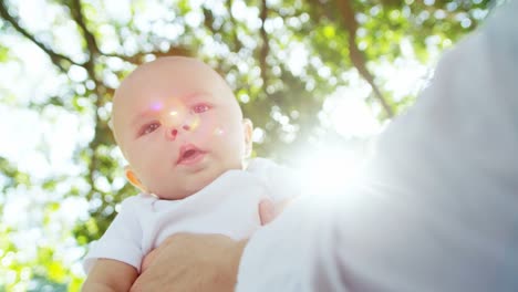 Portrait-of-Caucasian-baby-girl-sitting-in-park