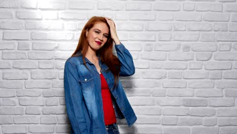 Facial-Expressions-Of-Young-Redhead-Woman-On-Brick-Wall