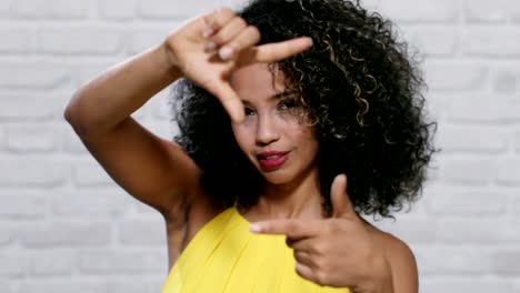 Facial-Expressions-Of-Young-Black-Woman-On-Brick-Wall