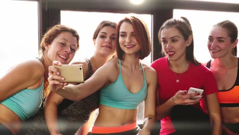 group-of-women-communicate-and-make-selfies