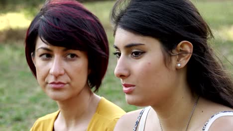 Young-women-talking-about-their-life-at-the-park--female-friendship