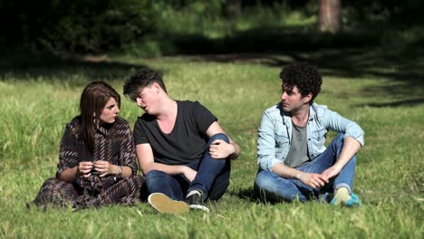 funny-guy-sings-on-the-lawn-while-his-friends-looking-at-him