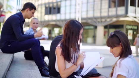 Group-of-creative-students-working-together-on-an-idea-on-paper.-Start-up-team-meeting-discussion-ideas-for-successful-project