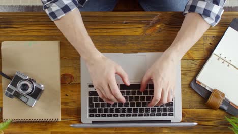 Top-View-of-Unrecognizable-Freelancer-Working-on-Laptop