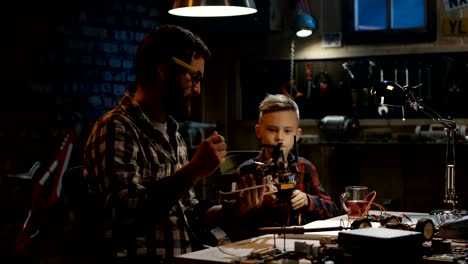 Father-and-son-repairing-a-drone