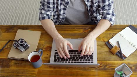 Unrecognizable-Man-Working-on-Laptop