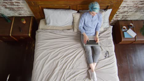 Female-Freelancer-Working-from-Bed