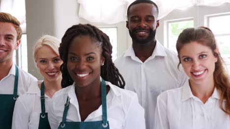 Portrait-Of-Restaurant-Management-And-Staff-Standing-In-A-Line