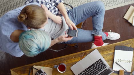 Young-Woman-Bringing-Coffee-to-Boyfriend