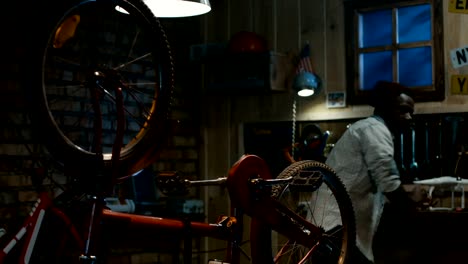 Man-working-in-a-bicycle-repair-shop