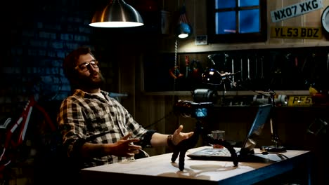 Young-man-talking-on-camera-in-a-garage