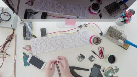 Female-electrician-strips-wires