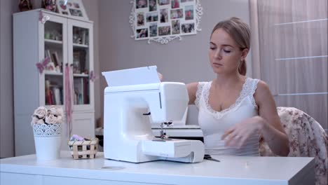 Young-woman-preparing-her-sewing-machine