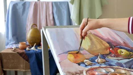 A-young-artist-in-an-art-workshop-draws-a-still-life-from-nature-in-watercolor