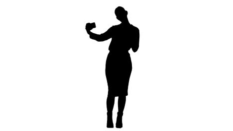 Silhouette-Young-pretty-businesswoman-take-selfie-with-cell-phone