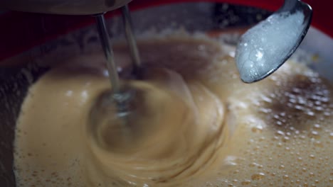 4K-Cake-Baker-Adding-Baking-Soda-while-Mixing