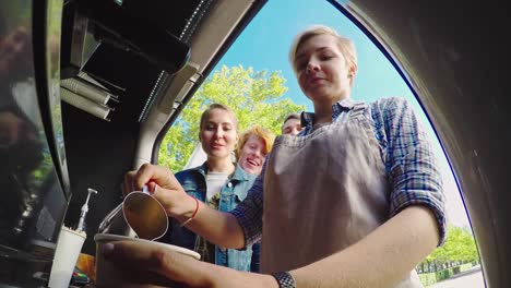 Blond-Barista-Making-Coffee-for-Customers