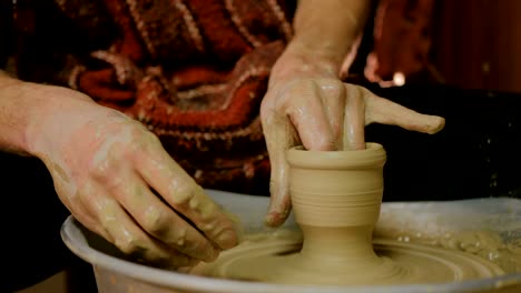 Professional-male-potter-working-in-workshop,-studio