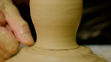 Professional-male-potter-working-in-workshop,-studio