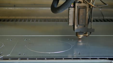 Laser-cut-machine-while-cutting-the-sheet-metal-with-sparks-and-high-precision