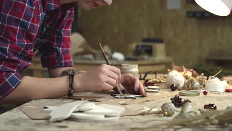 Young-Hipster-Painting-Handmade-Goods-in-her-Studio