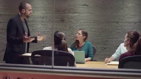 Man-leading-a-small-business-meeting