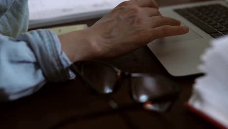 Freelancer-works-remotely-over-the-Internet-on-his-computer-sitting-in-the-home-office