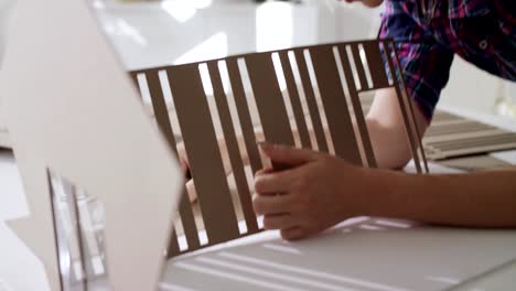 Woman-Working-As-Architect-Building-Housing-Model-Mock-up