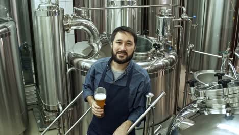 Brewery-Worker-Posing-with-Glass-of-Beer