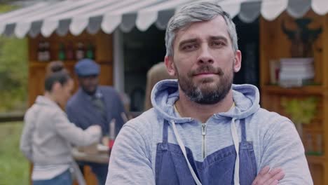 Portrait-of-caucasian-owner-small-business-near-his-food-booth