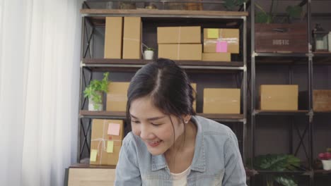 Beautiful-smart-Asian-young-entrepreneur-business-woman-owner-of-SME-feeling-happy-dancing-while-see-business-achievement.-Small-business-owner-at-home-office-concept.