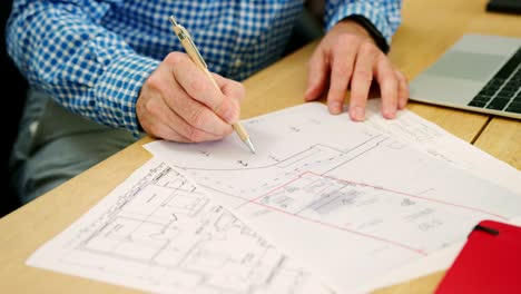 Architect-Is-Sketching-On-House-Plans-In-His-Studio