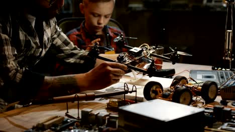 Father-and-son-repairing-a-drone