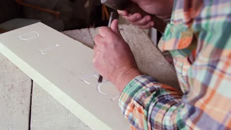 Stone-Mason-At-Work-On-Carving-In-Studio-Shot-On-RED-Camera