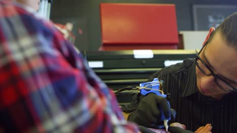 Close-Up-Of-Woman-Having-Tattoo-In-Parlor-Shot-On-R3D