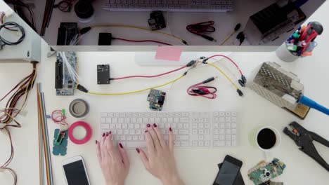 Electronics-engineer-typing-on-computer-keyboard