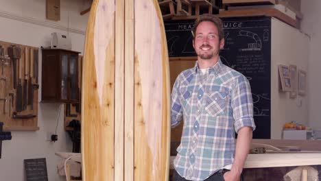 Portrait-Of-Carpenter-With-Surfboard-Shot-On-RED-Camera