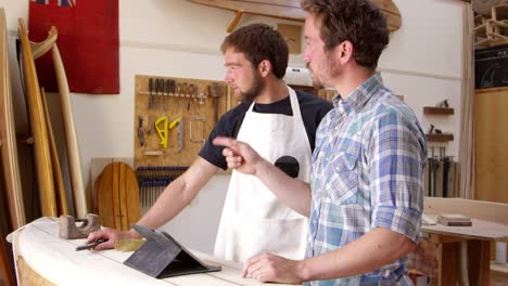 Carpenter-In-Workshop-With-Digital-Tablet-Shot-On-RED-Camera