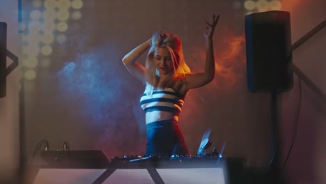 Blond-Woman-Playing-Music-on-Decks