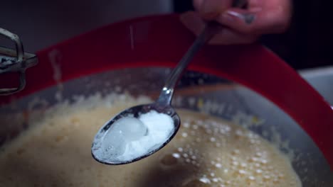 4K-Cake-Baker-Adding-Baking-Soda-to-Mixture