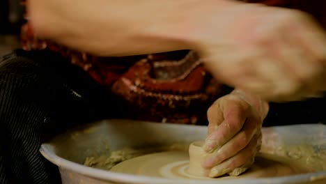 Professional-male-potter-working-in-workshop