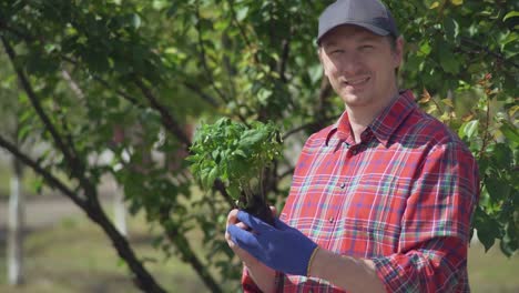 Guy-posing-with-plant